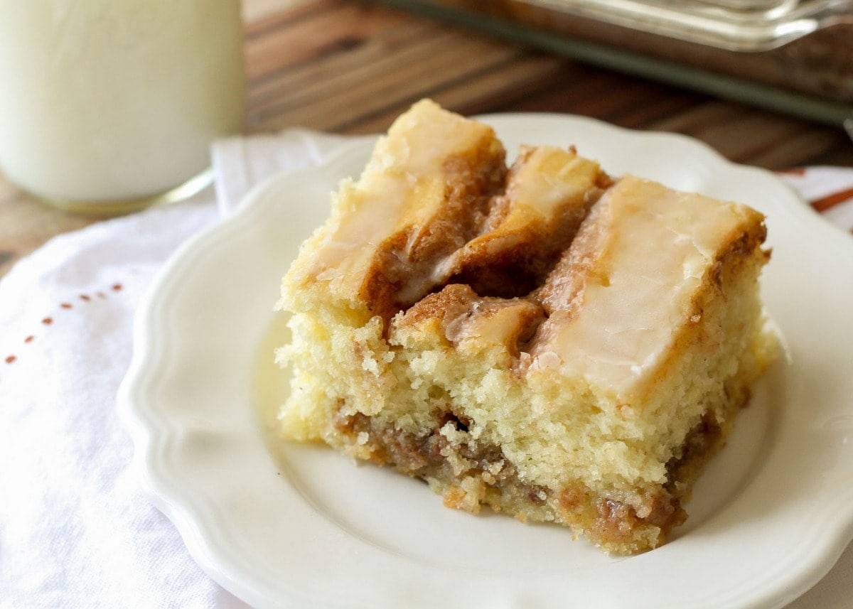 Easy Breakfast Ideas - a slice of cinnamon roll cake on a white plate. 