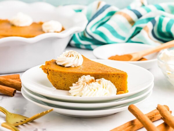 Slice of crustless pumpkin pie served on a white plate.