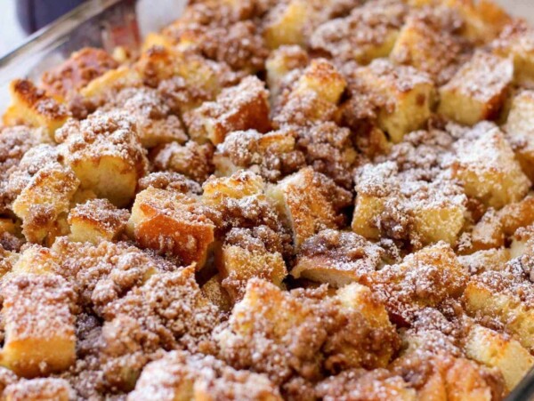 Close up image of French toast casserole in glass baking dish.