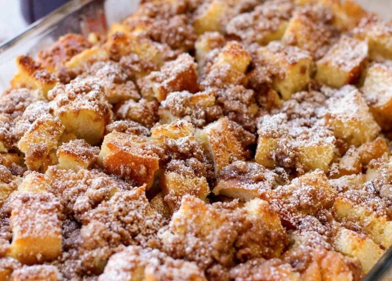 Close up image of French toast casserole in glass baking dish.