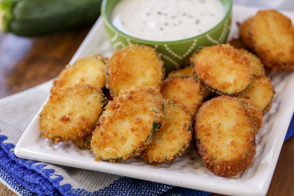 Crispy fried zucchini served with a dipping sauce.