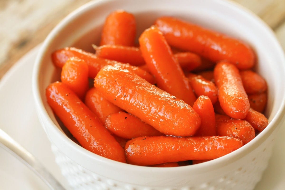 Valentines Dinner Ideas - brown sugar glazed carrots in a white bowl. 
