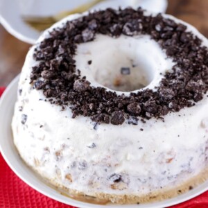 Angel food ice cream cake topped with crushed oreo.