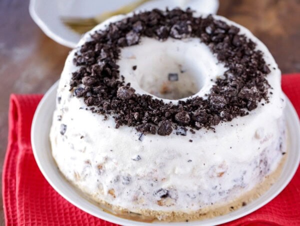 Angel food ice cream cake topped with crushed oreo.
