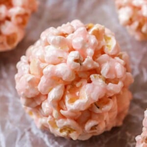 Popcorn Balls recipe on parchment paper close up image.