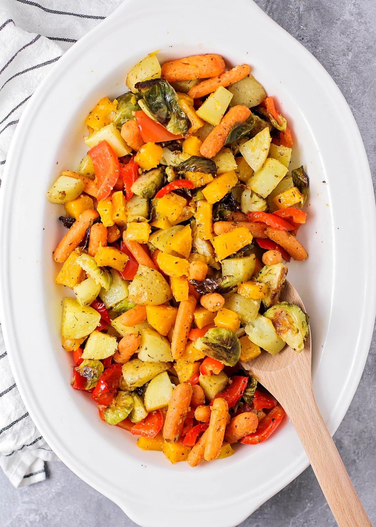 Roasted vegetables in a bowl all mixed together.