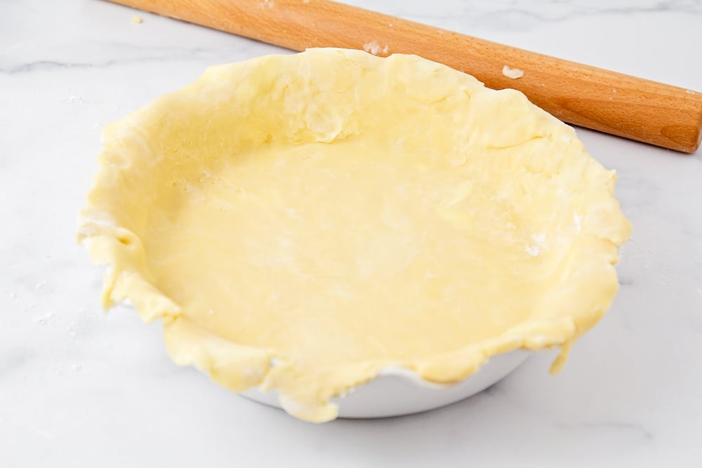 Pie crust over pie pan.