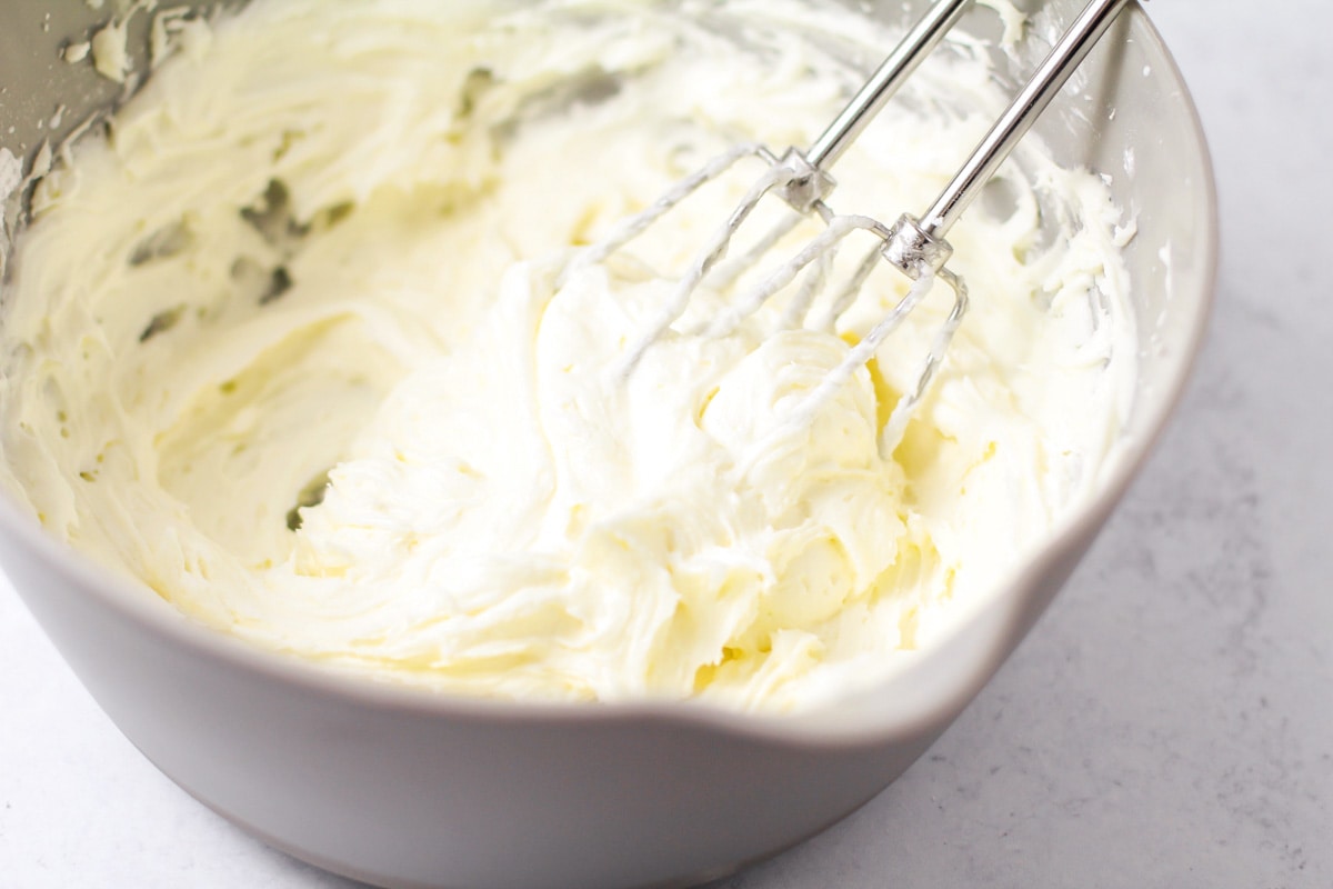 Whipped frosting for topping butter cookies.