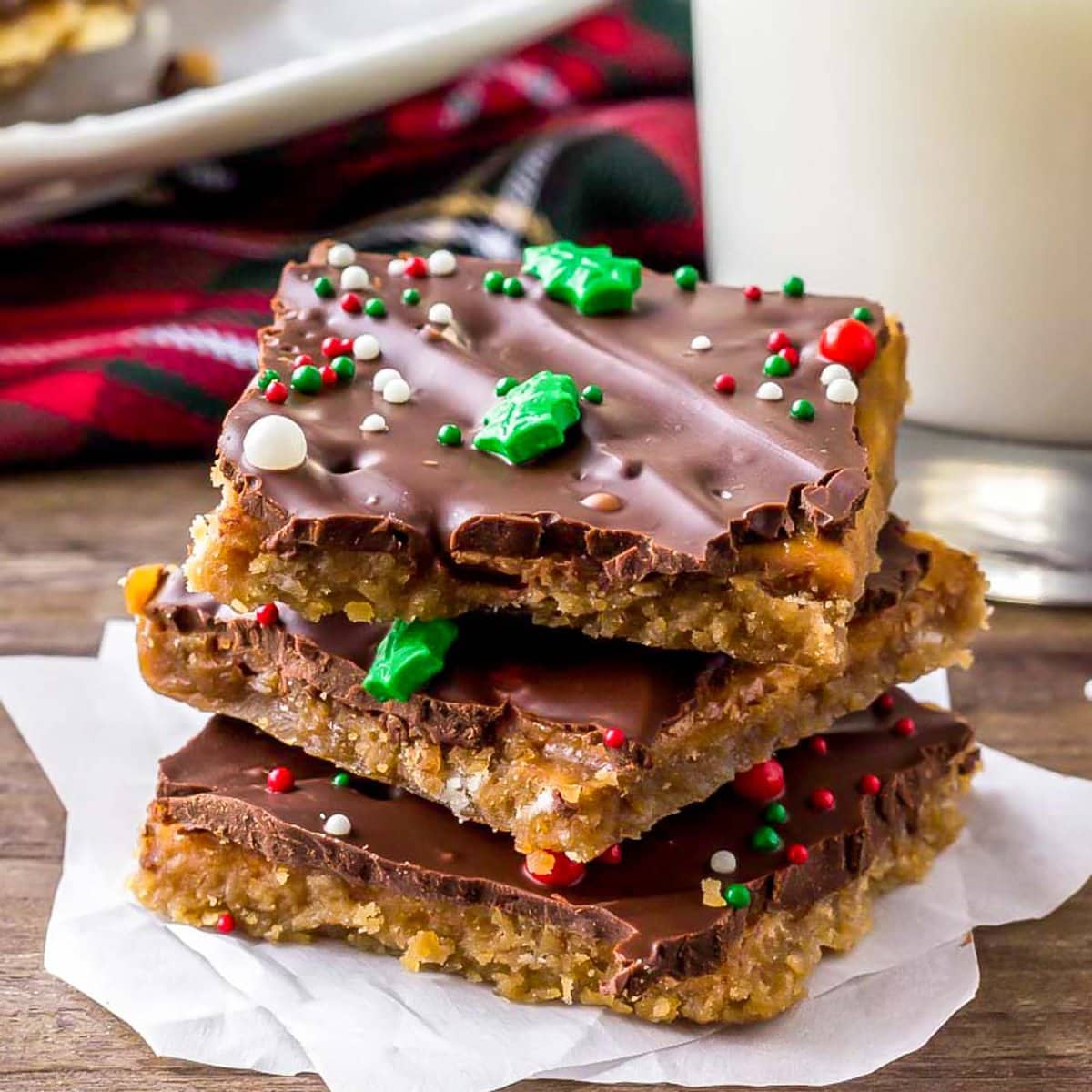 Christmas crack stacked  and topped with sprinkles.