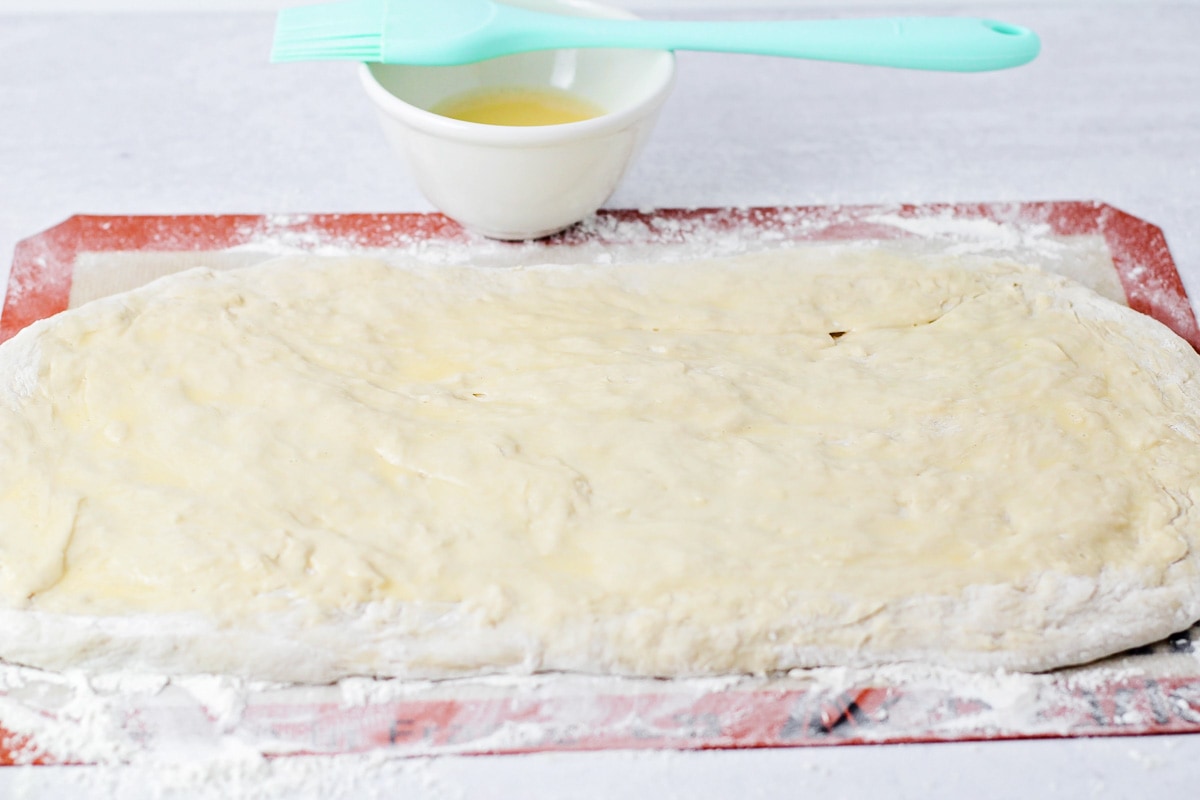 Dough rolled out with melted butter brushed on top.