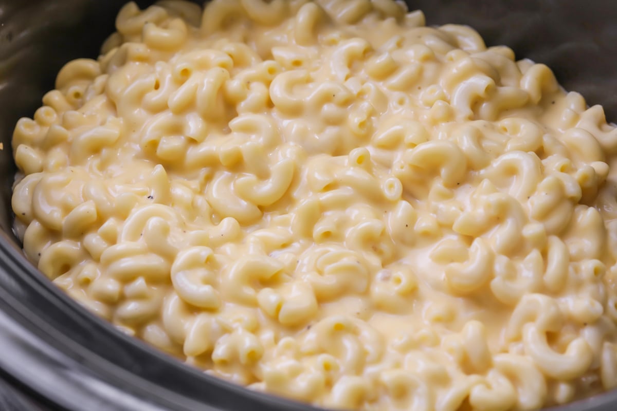 Close up of creamy crock pot mac and cheese in a slow cooker.