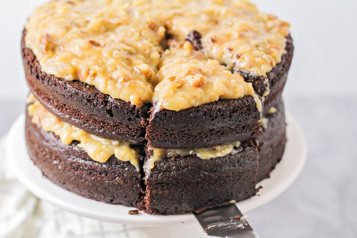 Slice of German Chocolate cake being dished out.