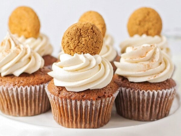Gingerbread cupcakes topped with frosting.