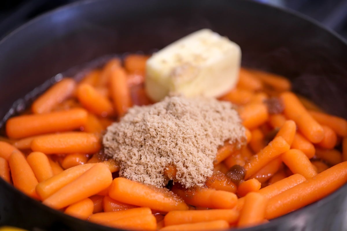 How to make brown sugar glazed carrots, ingredients in a pan.