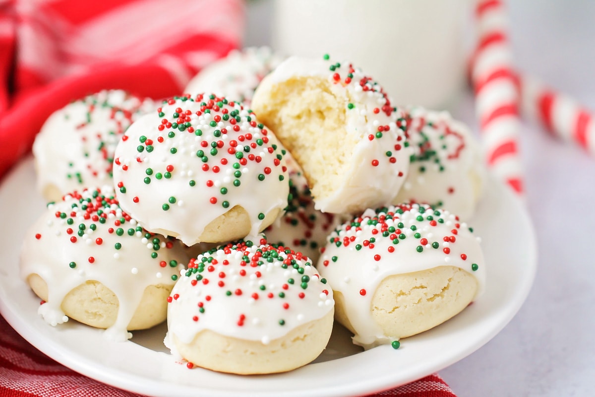 A plate filled with glazed Italian Christmas cookies.