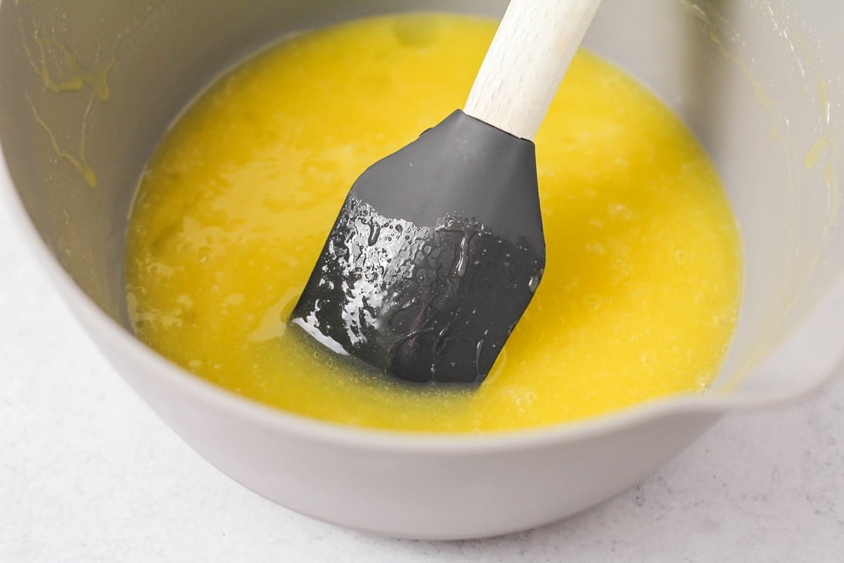 Melted butter in a bowl for making Italian cookies.
