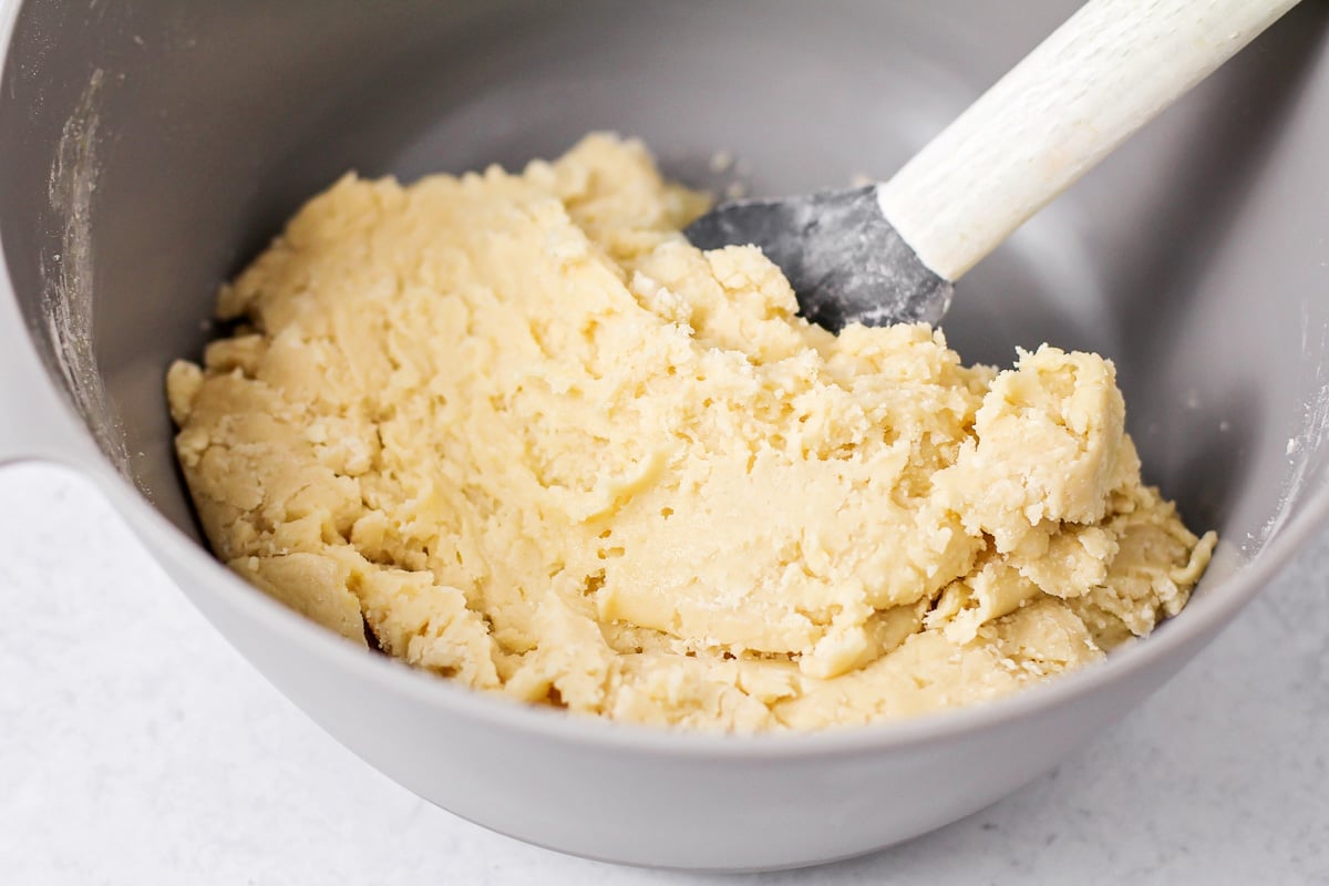Mixing Italian cookie batter in a bowl.