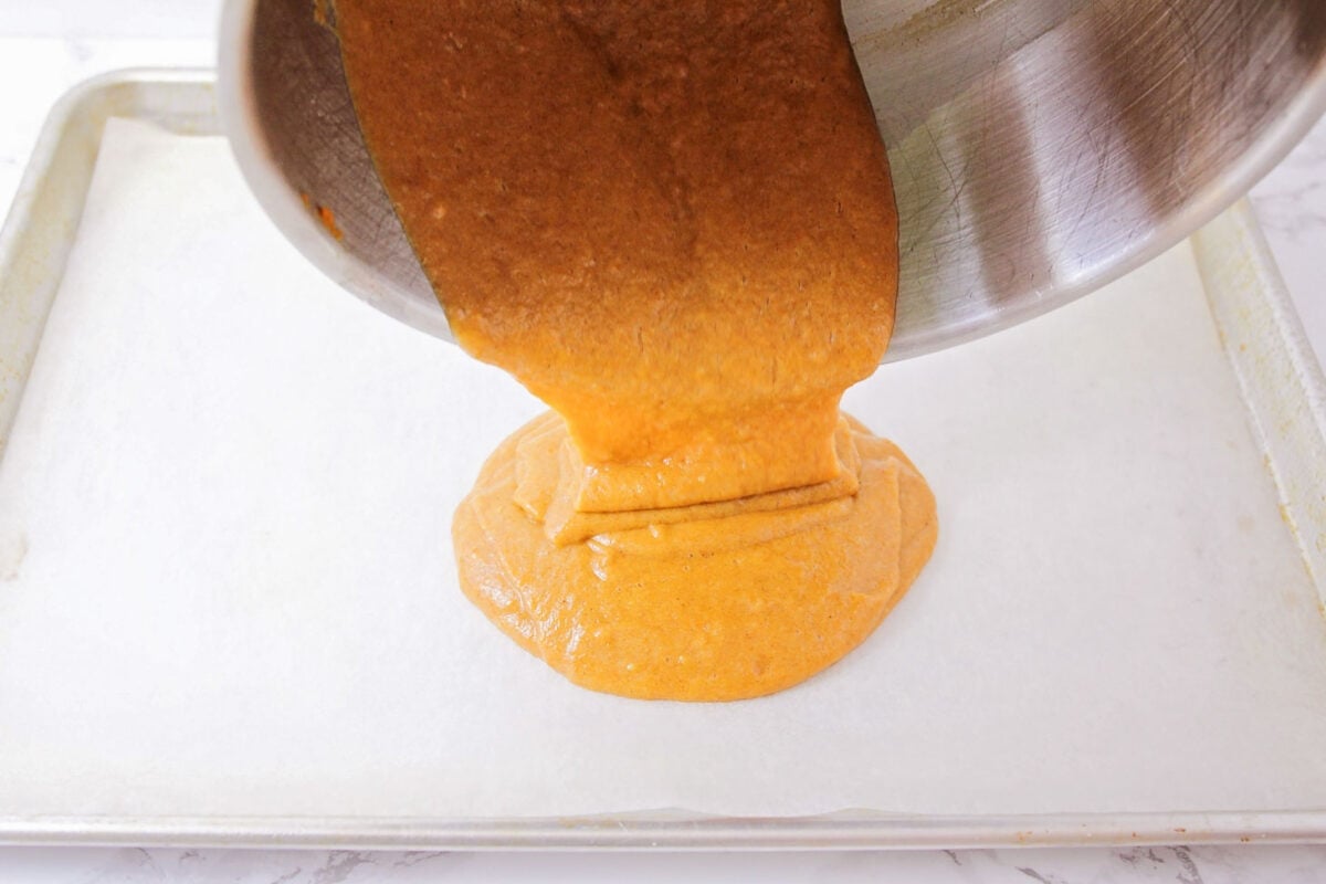 Batter being poured into jelly roll pan.