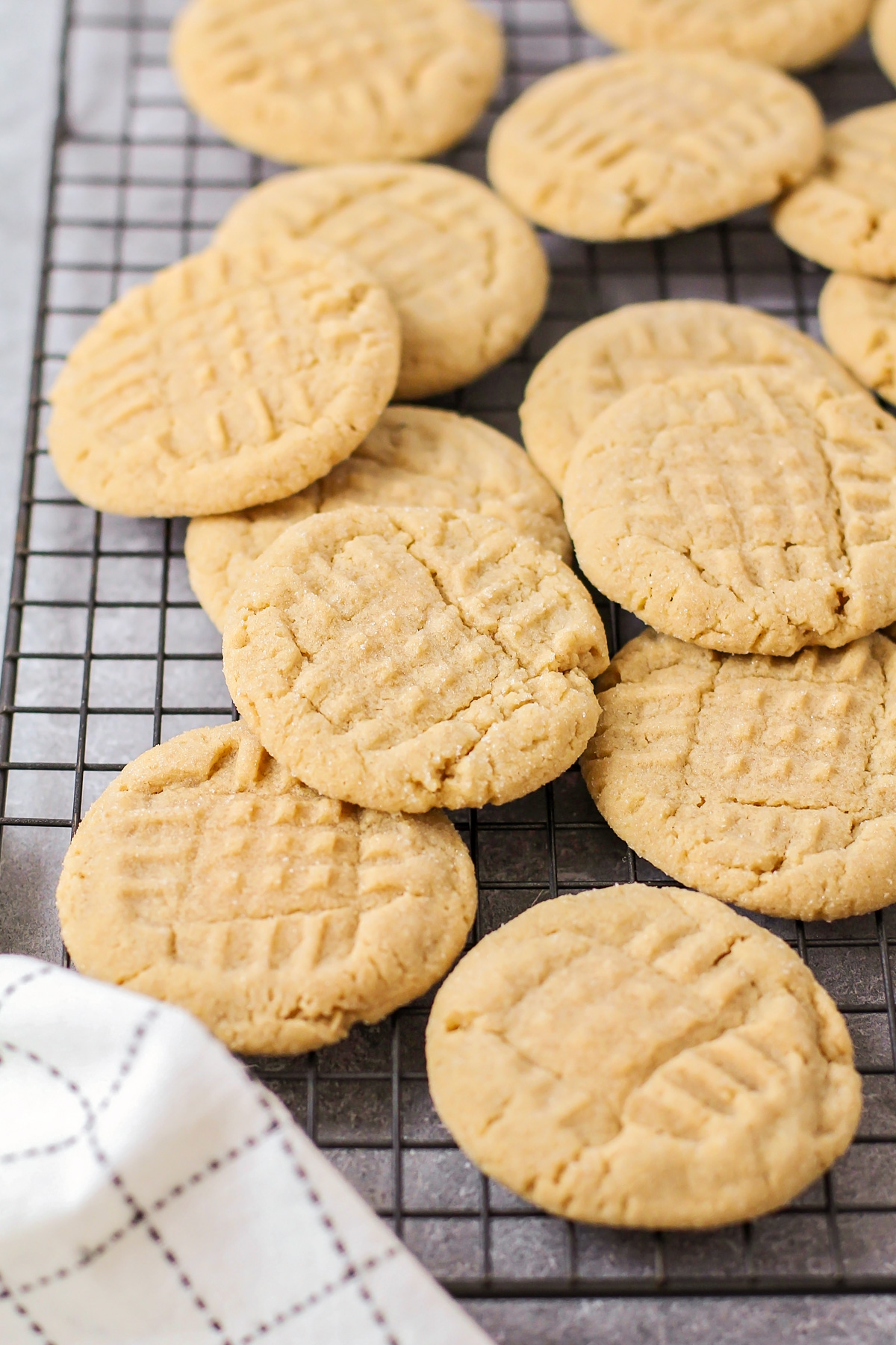 Peanut butter cookies cooling on a wire rack.
