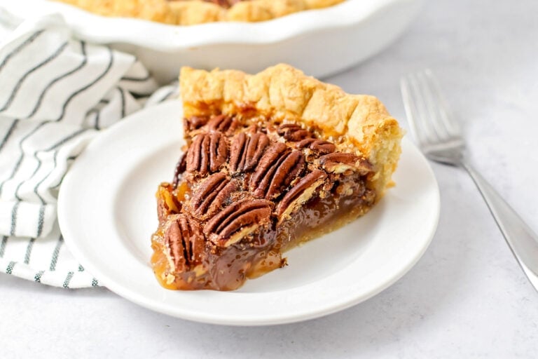 A slice of easy pecan pie recipe served on a white plate.