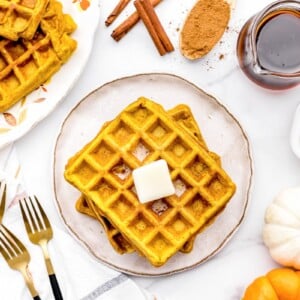 Pumpkin waffles topped with butter.