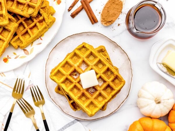 Pumpkin waffles topped with butter.