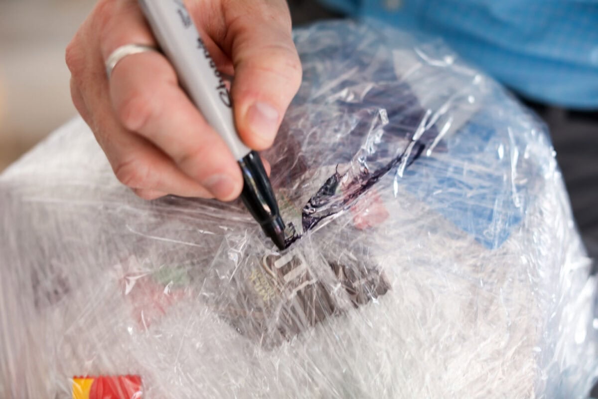 Marking where it ends on the Saran Wrap Ball game.