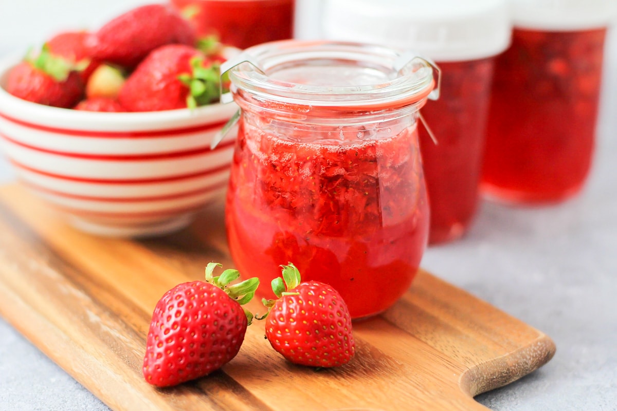 Close up of jars of fresh strawberry jam.