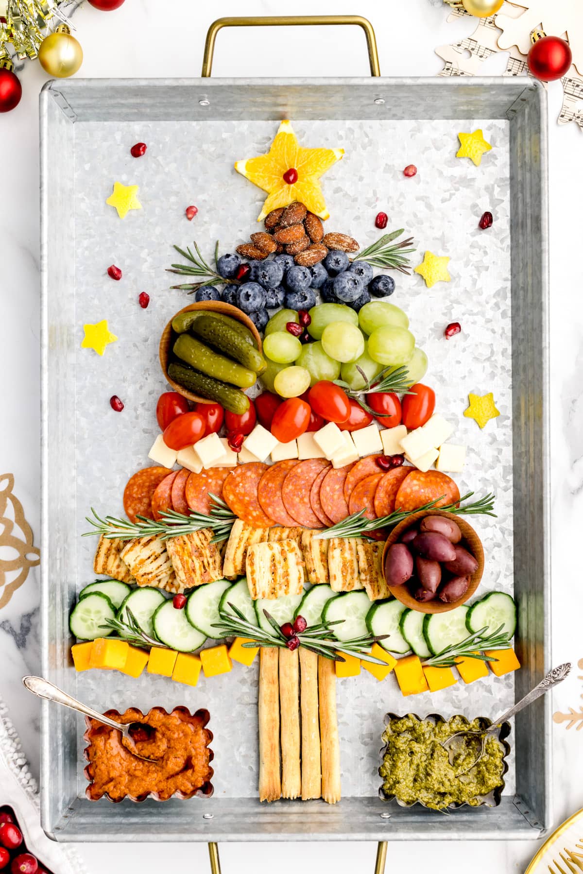 Christmas tree charcuterie board on silver tray.