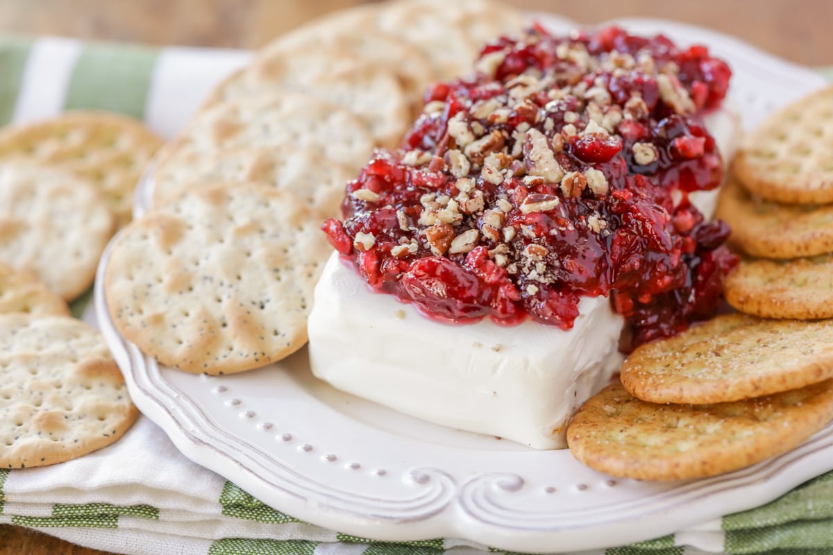 Close up of cranberry cream cheese dip served with crackers.