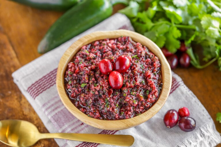Fresh cranberry salsa served in a wooden bowl.