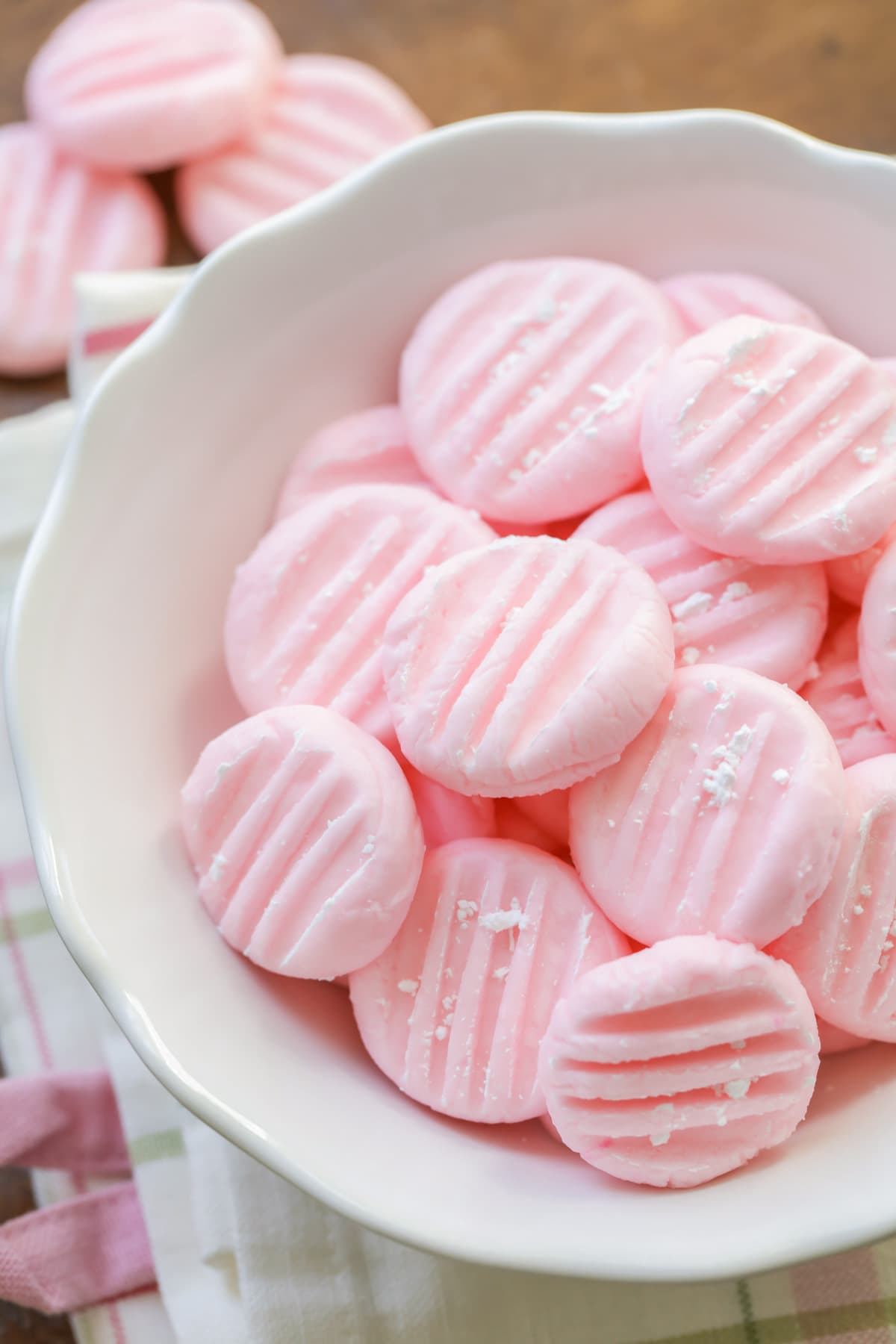 Pink Cream Cheese Wedding Mints piled in a bowl.