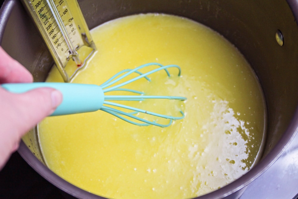 Melting butter and sugar in a pot on the stove.