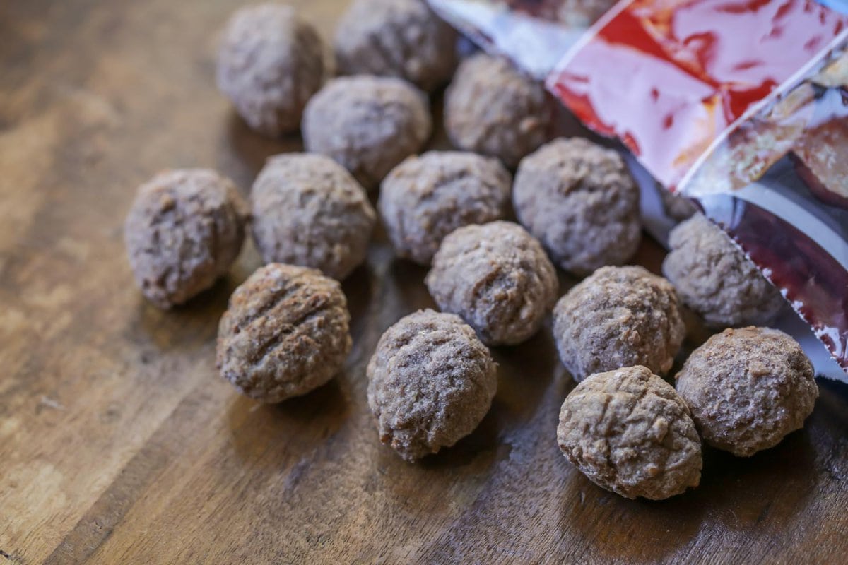 Frozen meatballs on table.