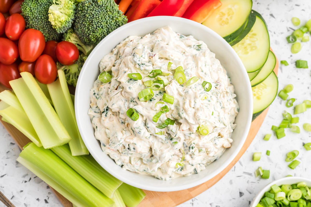 Knorr Spinach Dip served in a white bowl with veggies.