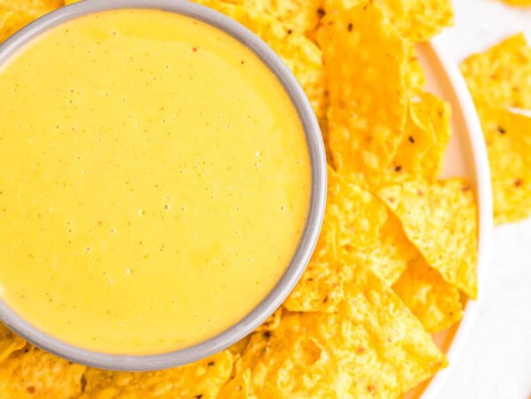 Homemade nacho cheese sauce in a white ramekin.
