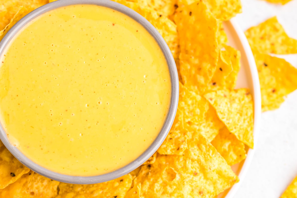 Nacho cheese sauce served with chips.
