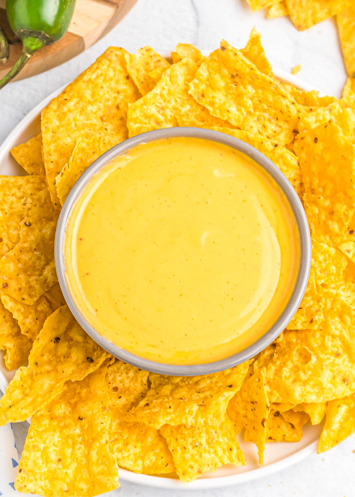 Nacho cheese served with tortilla chips.