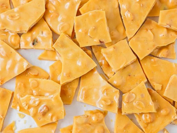 Easy peanut brittle recipe broken up into pieces.