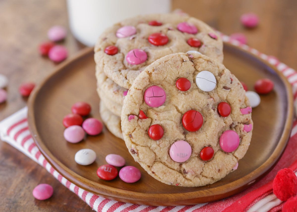 Valentine's Day Desserts - Valentine's M & M cookies on a wooden plate. 