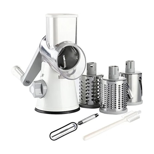 A white rotary cheese grater with a handle and multiple attachments on the side.