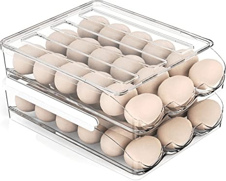 Kitchen organization ideas - Two stacked clear egg storage containers holding several eggs. 