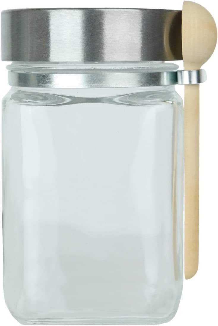 Kitchen organization ideas - A clear glass jar with metal lid and wood scooping spoon attached to the side.