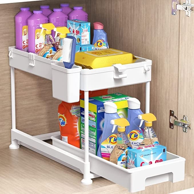 Kitchen organization ideas - White plastic organizer with bottom sliding tray holding a variety of cleaners in a cabinet.