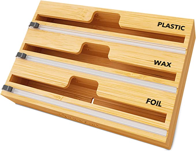 Kitchen organization ideas - A bamboo organizer with three slots for holding plastic wrap and tinfoil.