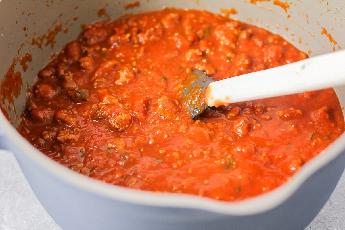 A bowl of sauce for making easy lasagna recipe.