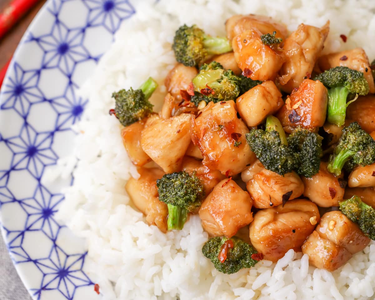 Honey chicken with broccoli served over white rice.