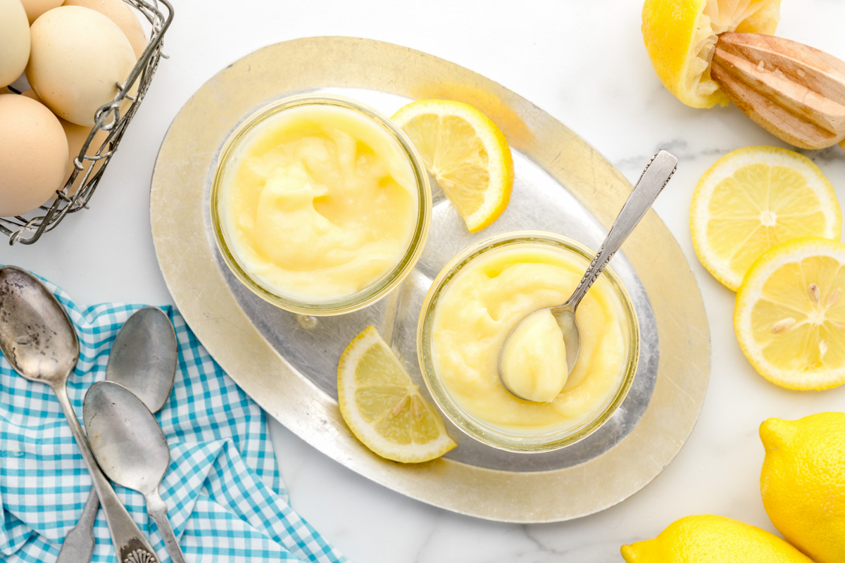 Lemon Curd served in small glass jars.