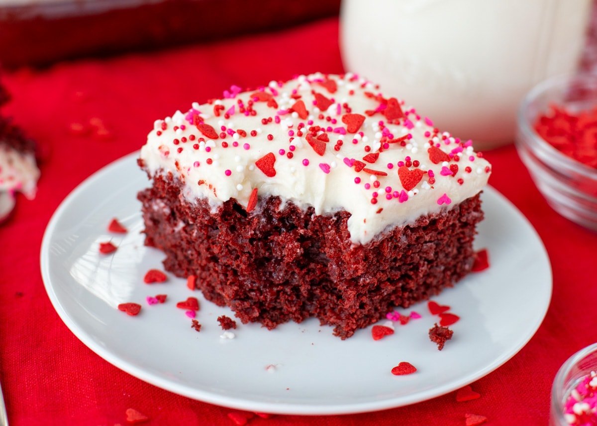 Red velvet poke cake recipe with bite taken out.