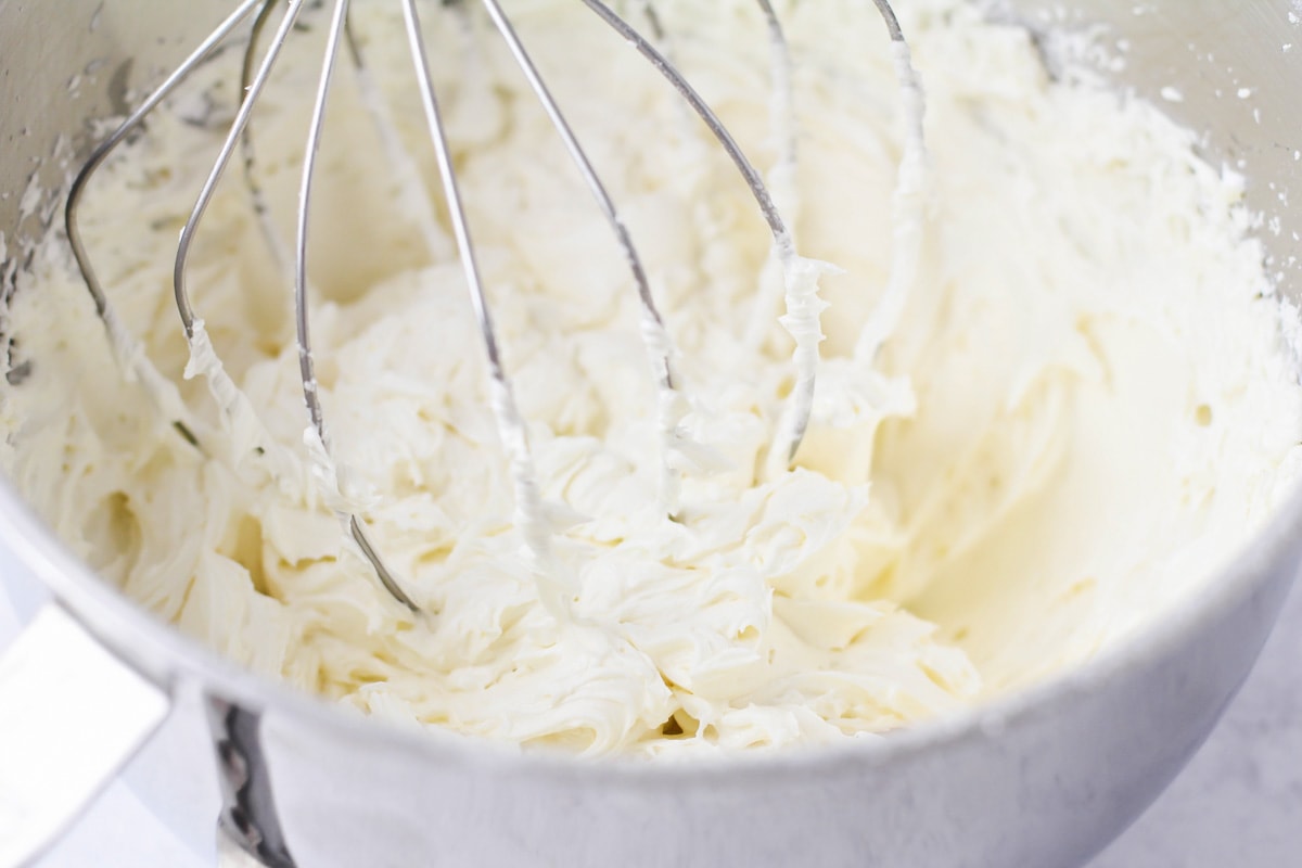 Mixing frosting in a stand mixer.